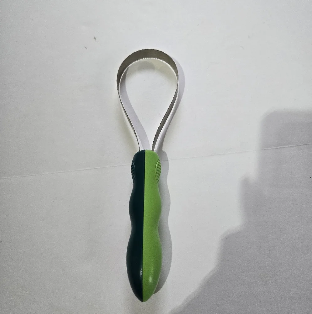 Green and Silver Grooming Tool